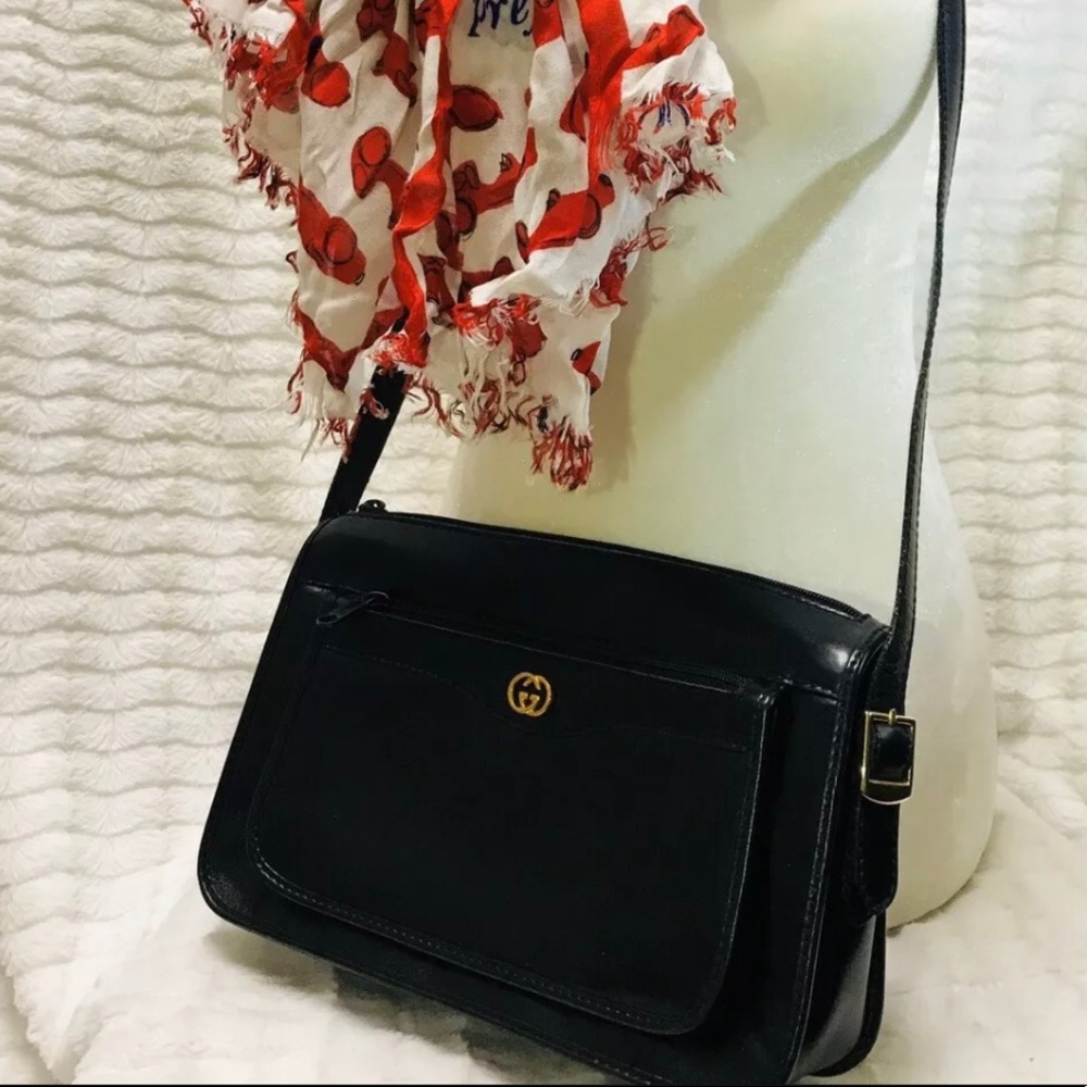 Vintage black leather Gucci bag with gold accents